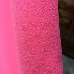 Imperfections found on Neon Pink Shirt